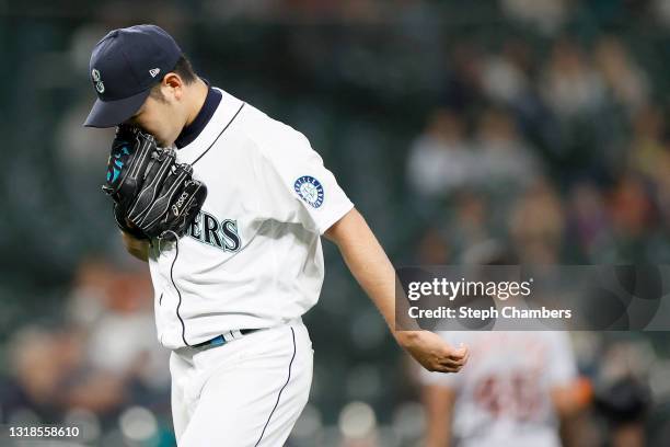 Yusei Kikuchi of the Seattle Mariners reacts after the top of the first inning against the Detroit Tigers at T-Mobile Park on May 17, 2021 in...