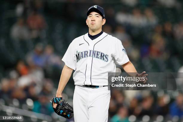 Yusei Kikuchi of the Seattle Mariners reacts after a walk against the Detroit Tigers during the first inning at T-Mobile Park on May 17, 2021 in...