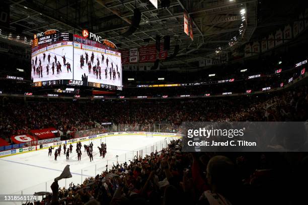 The Carolina Hurricanes celebrate their victory against the Nashville Predators following Game One of the First Round of the 2021 Stanley Cup...