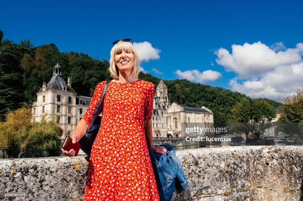 Female tourist at Brantome, Dordogne, France