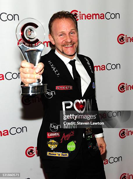 Director Morgan Spurlock poses with his Documentary Filmmaker of the Year award during CinemaCon at The Colosseum of Caesars Palace on March 30, 2011...