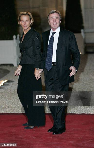 French Foreign Minister Bernard Kouchner and his wife Christine Ockrent arrives to attend a state dinner honouring visiting Chinese President Hu...