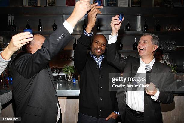 Guests toast to DJ D-Nice at a Hennessey Black party to celebrate DJ D-Nice signing to Roc Nation DJ's at The Cooper Square Hotel on November 16,...