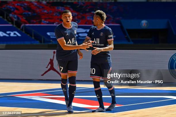 Kylian Mbappe and Neymar Jr react as the Paris Saint-Germain unveils the new Jordan kit on May 17, 2021 in Paris, France.