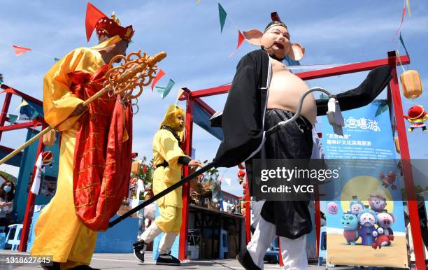 Cast members dressed as characters from Chinese classical novel 'Journey to the West' perform at Huaguo Mountain Scenic Area one day before China...