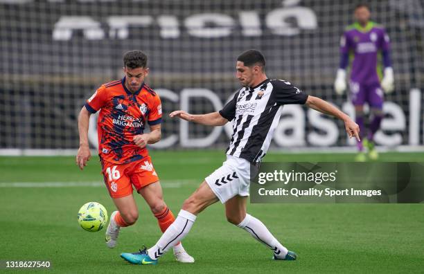 Yann Bodiger of CD Castellon competes for the ball with Curro Sanchez of SD Ponferradina during the Liga Smartbank match betwen CD Castellon and SD...