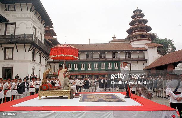 New Nepalese King Gyanendra sits on the throne reserved for coronations and wears the king''s crown during a swearing-in ceremony June 4, 2001 at the...