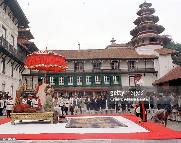 New Nepalese King Gyanendra sits on the throne reserved for coronations and wears the king''s crown during a swearing-in ceremony June 4, 2001 at the...