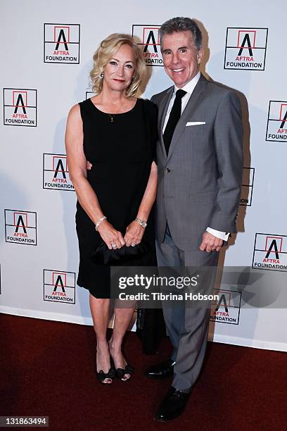 Reve Drew and John Walsh arrive at the 2011 AFTRA AMEE Awards at Club Nokia on March 21, 2011 in Los Angeles, California.