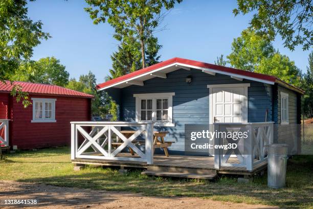 holiday in poland - colorful, swedish style cabin houses in a summer day - bungalow stock pictures, royalty-free photos & images