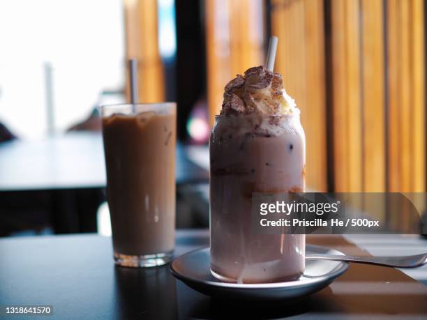 close-up of drink in glass on table - blended coffee drink stock pictures, royalty-free photos & images