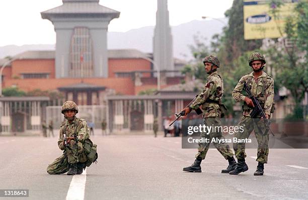 Soldiers take up positions in front of the Royal Palace June 4, 2001 during a citywide curfew in Katmandu, Nepal. King Gyanendra, the brother of...