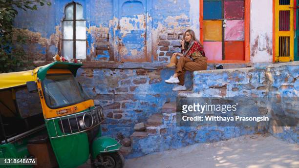 blue city jodhpur portrait. - rajasthani women stock-fotos und bilder