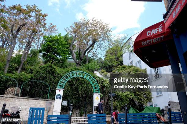 An out door seating area being built in front of the iconic Moulin de la Galette in the touristic Montmartre district of Paris ahead of its...