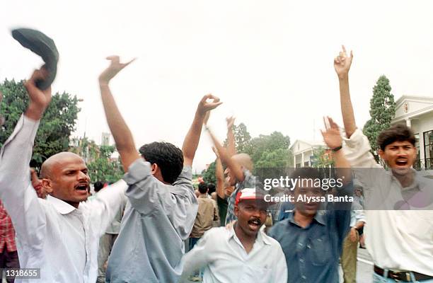 Protesters react after the announcement of the death of King Dipendra and the coronation of his uncle, King Gyanendra, June 4, 2001 in Katmandu,...