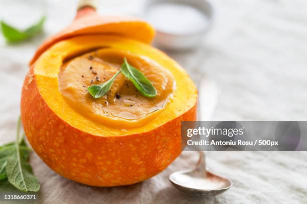 close-up of pumpkin soup on table - pumpkin soup stock pictures, royalty-free photos & images
