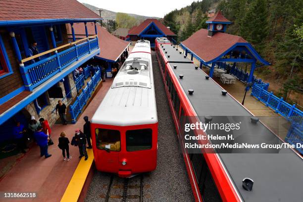 The Broadmoor Manitou and Pikes Peak Cog Railway train sits in the station before it heads up Pikes Peak on May 16, 2021 in Manitou Springs,...