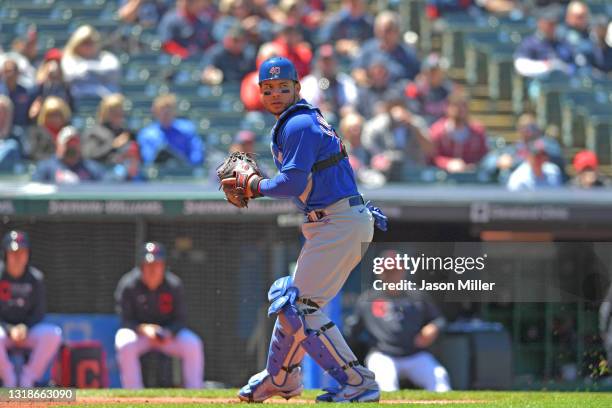 Catcher Willson Contreras of the Chicago Cubs throws out Andres Gimenez of the Cleveland Indians at first to end the second inning at Progressive...