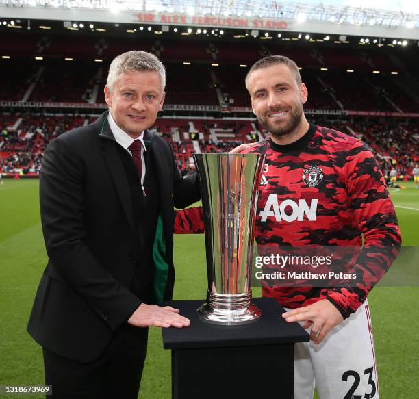 Luke Shaw of Manchester United poses with the Players' Player of the Year award ahead of the Premier League match between Manchester United and...
