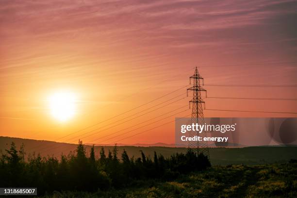 154,000 volt power transmission line - communications tower sunset stock pictures, royalty-free photos & images