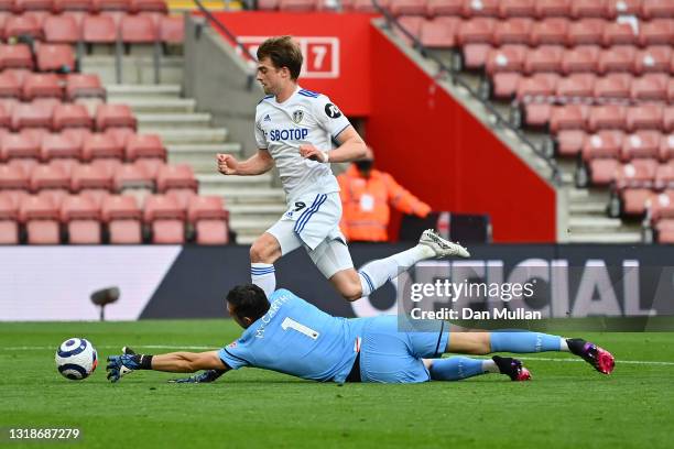 Patrick Bamford of Leeds United battles for possession with Alex McCarthy of Southampton during the Premier League match between Southampton and...