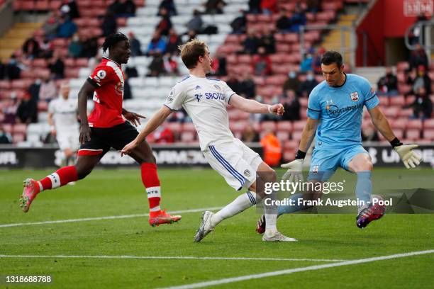 Patrick Bamford of Leeds United scores their sides first goal past Alex McCarthy of Southampton during the Premier League match between Southampton...