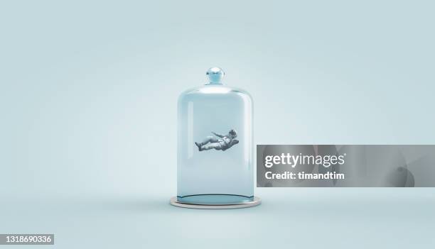 astronaut inside a bell jar - campana de vacío fotografías e imágenes de stock