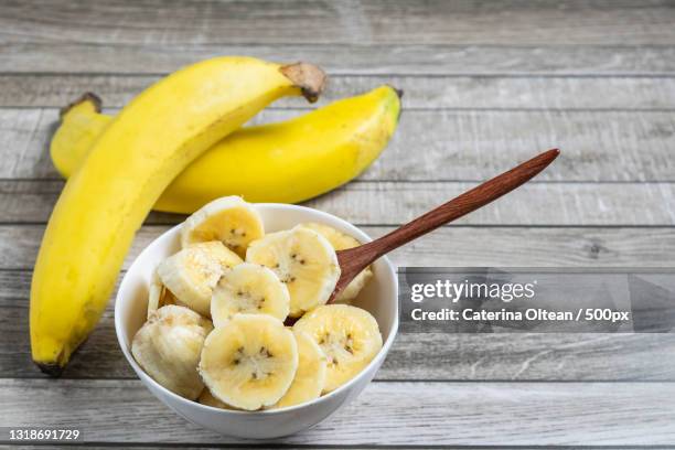 high angle view of fruits in bowl on table - banana stock pictures, royalty-free photos & images