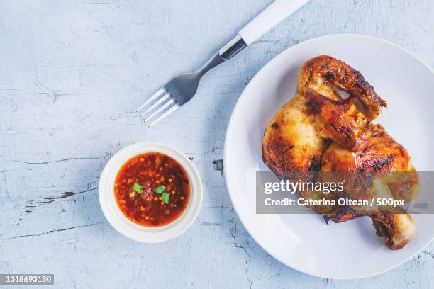 directly above shot of chicken meat in plate on table - half complete stock pictures, royalty-free photos & images