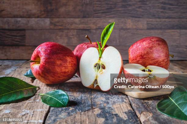 close-up of apples on table - fall harvest table stock pictures, royalty-free photos & images