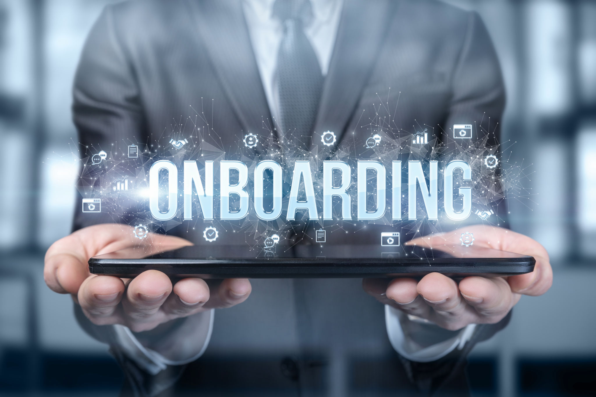 Businessman shows on the tablet the word onboarding . Businessman shows on the tablet the word onboarding .