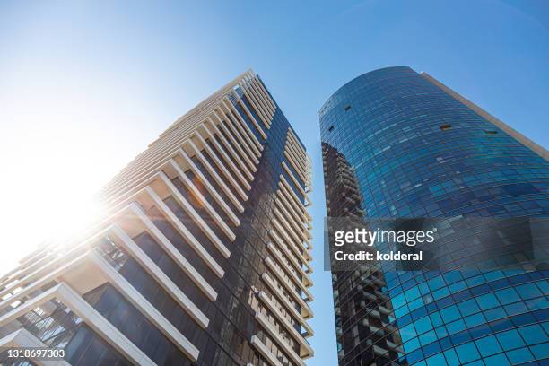 office buildings against blue sky - israel finance stock-fotos und bilder
