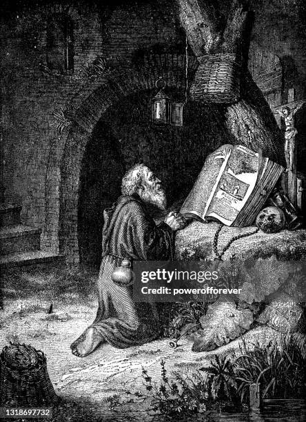 a hermit in prayer by gerrit dou - 17th century - open bible stock illustrations