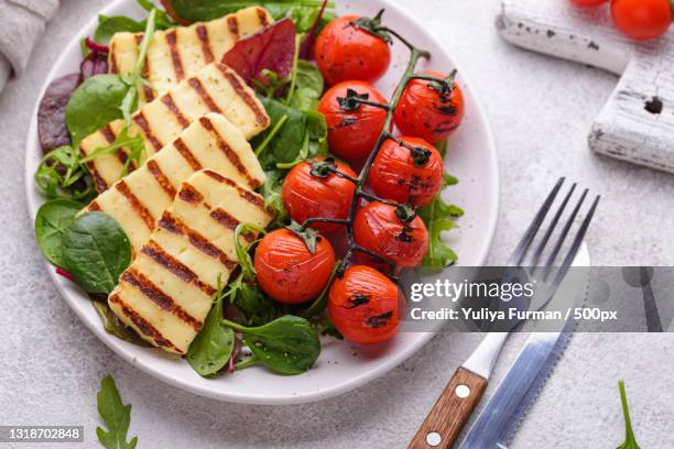 high angle view of salad in plate on table - grilled halloumi stock pictures, royalty-free photos & images