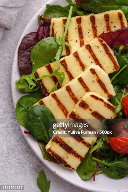 high angle view of food in plate on table - grilled halloumi stock pictures, royalty-free photos & images