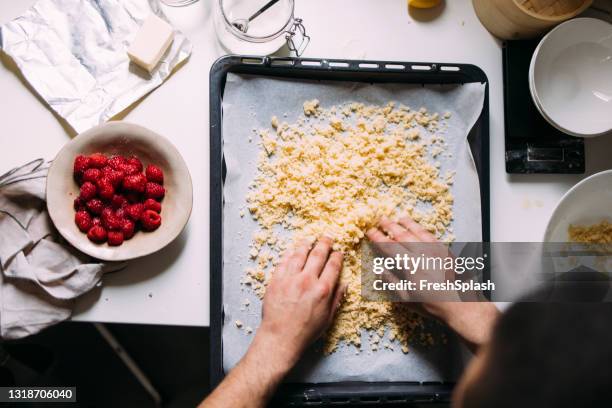 anonymous male caucasian professional chef preparing tasty meals in a private kitchen - cobbler stock pictures, royalty-free photos & images