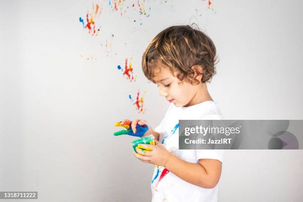 boy showing colorful paint on his hands - smile drawing stock pictures, royalty-free photos & images