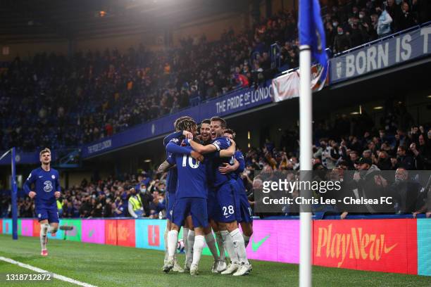 Jorginho of Chelsea celebrates after scoring their sides second goal from the penalty spot with team mates during the Premier League match between...
