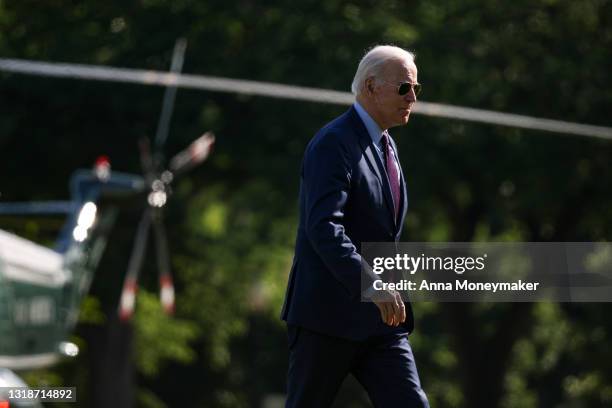 President Joe Biden walks on the Ellipse after stepping off Marine One near the White House on May 18, 2021 in Washington, DC. President Biden spent...