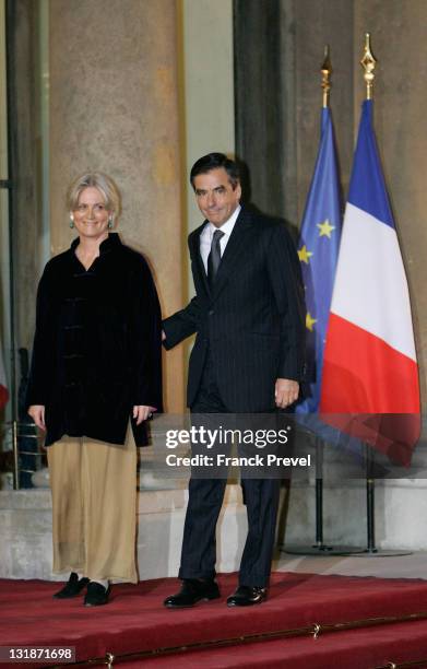 French Prime Minister with his wife arrive at a state dinner honouring visiting Chinese President Hu Jintao at Elysee Palace on November 4, 2010 in...
