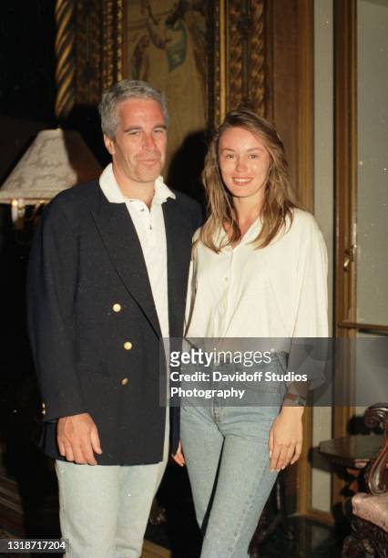 Portrait of American socialite Jeffrey Epstein and Norwegian college student Celina Midelfart as they pose together during a reception at the...