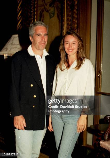 Portrait of American socialite Jeffrey Epstein and Norwegian college student Celina Midelfart as they pose together during a reception at the...