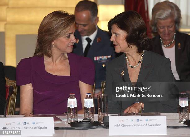 Princess Cristina of Spain and Queen Silvia of Sweden attend a conference dealing with "Vulnerable children on the run" at the Royal Palace on...