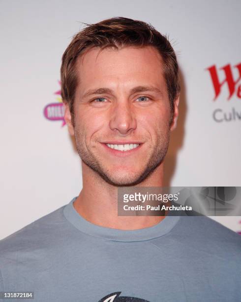 Reality TV personality Jake Pavelka from ABC's "The Bachelor" creates a signature milkshake at Millions Of Milkshakes on March 26, 2011 in Culver...