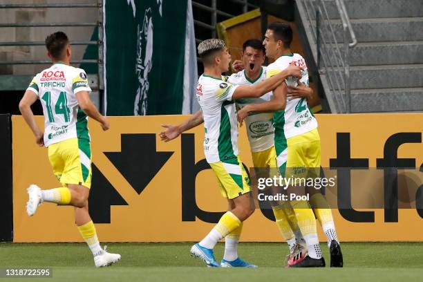 Walter Bou of Defensa y Justicia celebrates with teammates after scoring the first goal of his team during a match between Palmeiras and Defensa y...