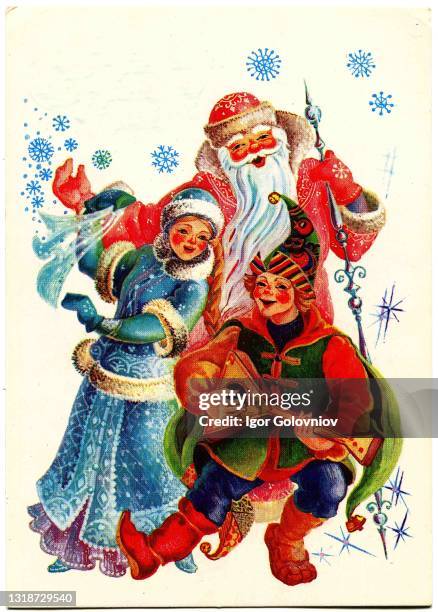 Postcard printed in the USSR shows draw by Pohitonova - Dancing Santa Claus, Snow Maiden, and parsley with a balalaika in his hands, circa 1985.