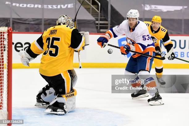 Casey Cizikas of the New York Islanders attempts a shot against Tristan Jarry of the Pittsburgh Penguins during the first period in Game Two of the...