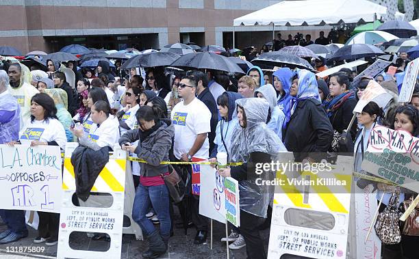 Protestors in the rain at the Downtown Los Angeles Rally In Opposition Of HR1 With Mayor Antonio Villaraigosa at Edward Roybal Federal Plaza on March...