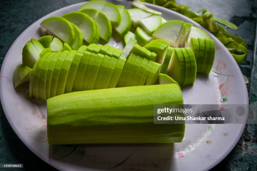 Green Sliced vegetable,Calabash (Lagenaria siceraria), also known as bottle gourd, white-flowered gourd, long melon, New Guinea bean and Tasmania bean, is a vine grown vegetable.