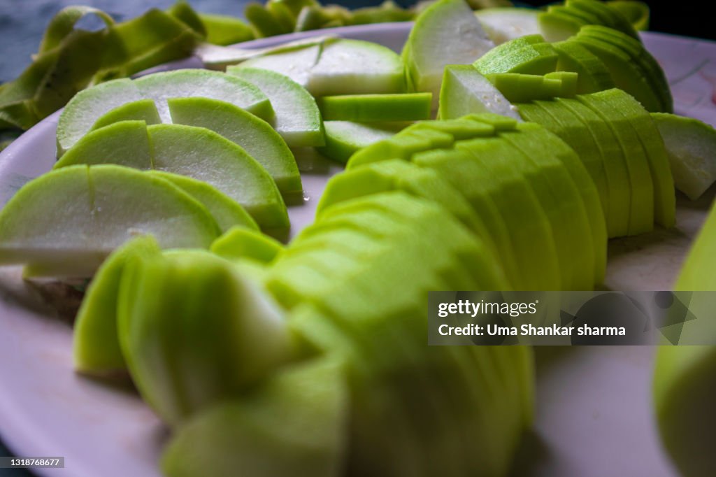 Green Sliced vegetable,Calabash (Lagenaria siceraria), also known as bottle gourd, white-flowered gourd, long melon, New Guinea bean and Tasmania bean, is a vine grown vegetable.